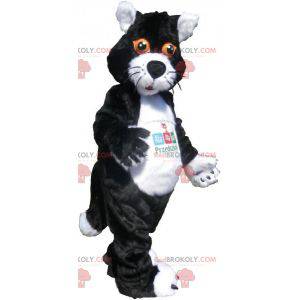 Mascotte de chat noir et blanc avec les yeux orange -