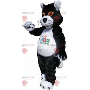 Schwarzweiss-Katzenmaskottchen mit orangefarbenen Augen -