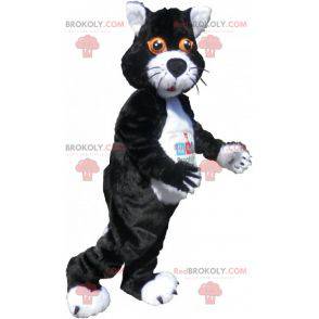 Mascote gato preto e branco com olhos laranja - Redbrokoly.com