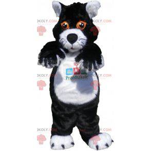 Schwarzweiss-Katzenmaskottchen mit orangefarbenen Augen -