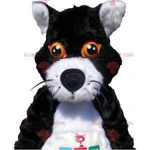 Schwarzweiss-Katzenmaskottchen mit orangefarbenen Augen -