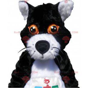 Schwarzweiss-Katzenmaskottchen mit orangefarbenen Augen -