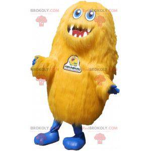 Mascotte de monstre jaune tout poilu. Mascotte de grizzli -