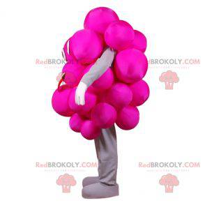 Maskottgrupp av rosa druvor. Festlig rosa maskot -