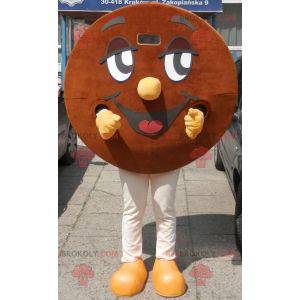 Gigantyczna okrągła uśmiechnięta i brązowa maskotka cookie -