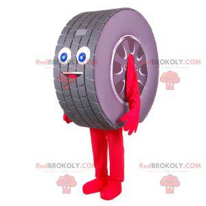 Mascota de neumático gigante muy sonriente. Mascota de rueda de