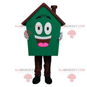 Veldig smilende gigantisk husmaskot grønn og brun -