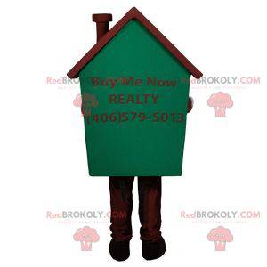 Mascota de la casa gigante muy sonriente verde y marrón -