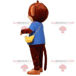Mascote macaco marrom com um saco em forma de banana -