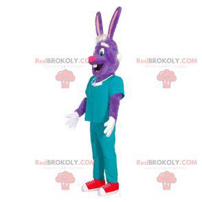 Mascotte de lapin violet en tenue de chirurgien. -