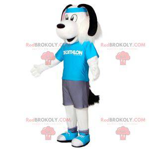 Mascote cachorro branco e preto em roupas esportivas com