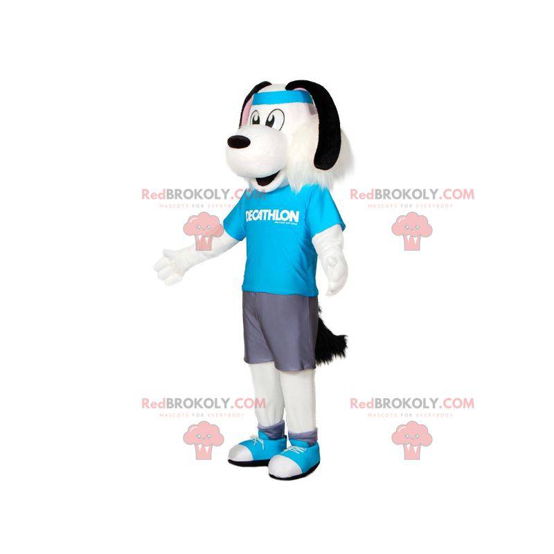 Mascote cachorro branco e preto em roupas esportivas com