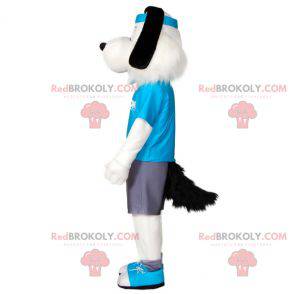 Hvid og sort hundemaskot i sportstøj med pandebånd -