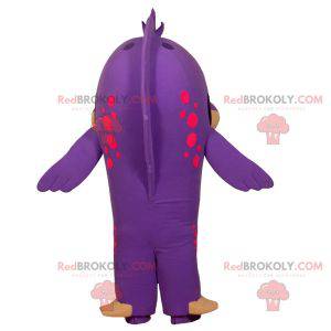 Mascote peixe roxo e bege engraçado e sorridente -