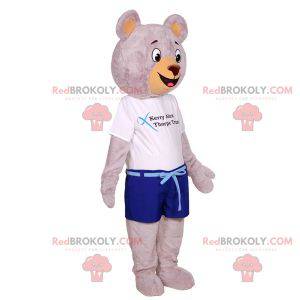 Big gray teddy bear mascot dressed in summer clothes -
