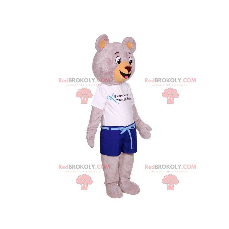 Mascota de oso de peluche gris grande vestida con ropa de