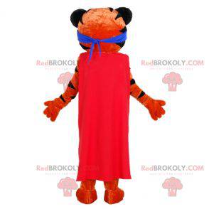 Mascota tigre naranja y negro con una diadema y una capa -