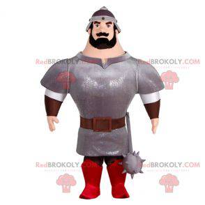 Mascotte cavaliere molto muscoloso con armatura e casco -
