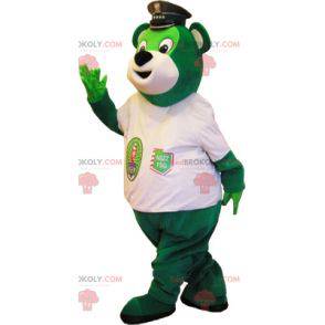 Mascotte dell'orso verde con un berretto della polizia -