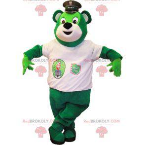 Grünes Bärenmaskottchen mit einer Polizeimütze - Redbrokoly.com