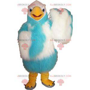 Haariges weißes und blaues Geiermaskottchen. Adler Maskottchen