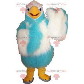 Haariges weißes und blaues Geiermaskottchen. Adler Maskottchen