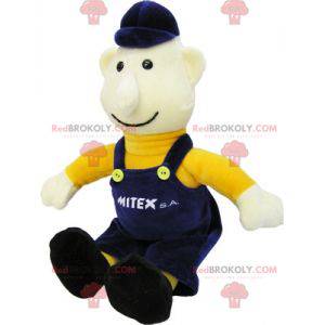 Arbeiter Schneemann Maskottchen in blauen Overalls gekleidet -