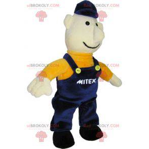 Arbeiter Schneemann Maskottchen in blauen Overalls gekleidet -