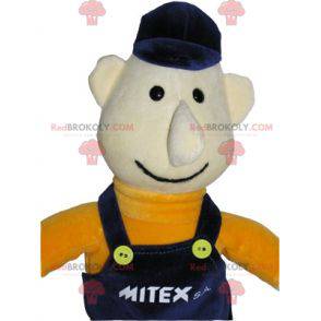 Arbeiter Schneemann Maskottchen in blauen Overalls gekleidet -