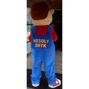 Young smiling boy mascot dressed in overalls - Redbrokoly.com