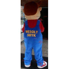 Menino mascote sorridente vestido de macacão - Redbrokoly.com