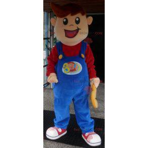 Menino mascote sorridente vestido de macacão - Redbrokoly.com