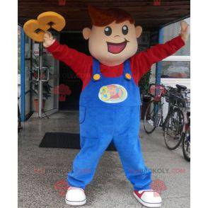Menino mascote sorridente vestido de macacão - Redbrokoly.com