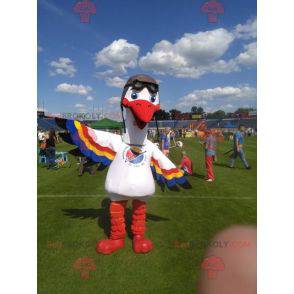 Weißstorch Maskottchen mit bunten Flügeln - Redbrokoly.com