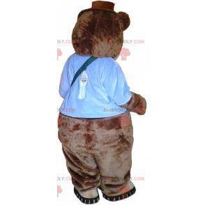 Grande mascotte marrone dell'orsacchiotto con una cartella -