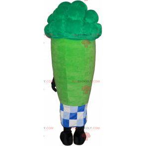 Giant green asparagus mascot surrounded by a checkered paper -