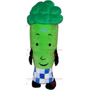 Giant green asparagus mascot surrounded by a checkered paper -