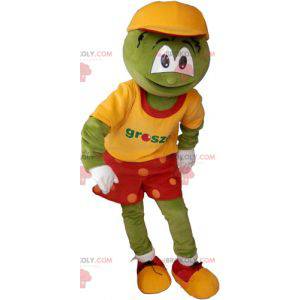 Mascotte de bonhomme rigolo vert en tenue coloré -