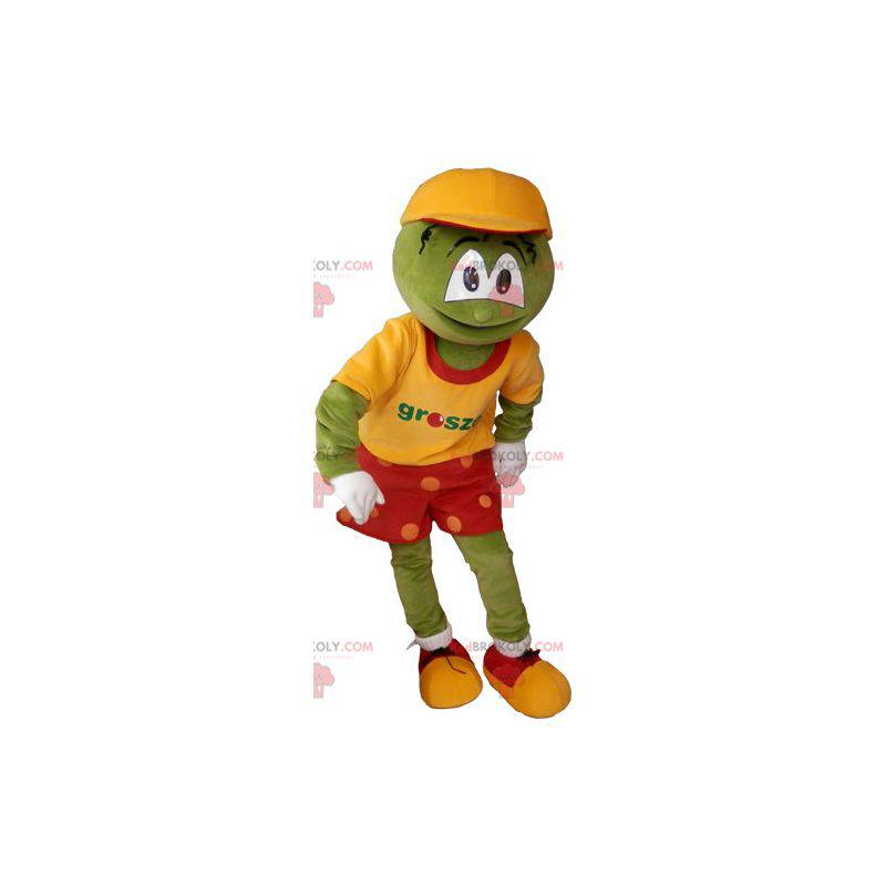 Mascotte de bonhomme rigolo vert en tenue coloré -