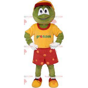 Green funny snowman mascot in colorful outfit - Redbrokoly.com