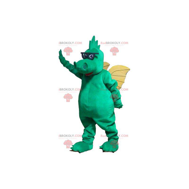 Mascota del dragón verde con alas amarillas y gafas -