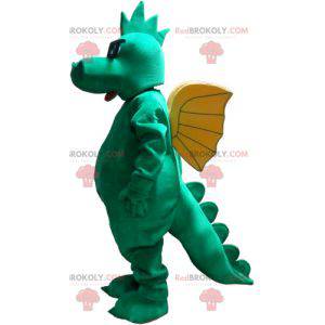 Mascota del dragón verde con alas amarillas y gafas -
