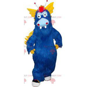 Mascotte de gros monstre bleu et jaune tout poilu -