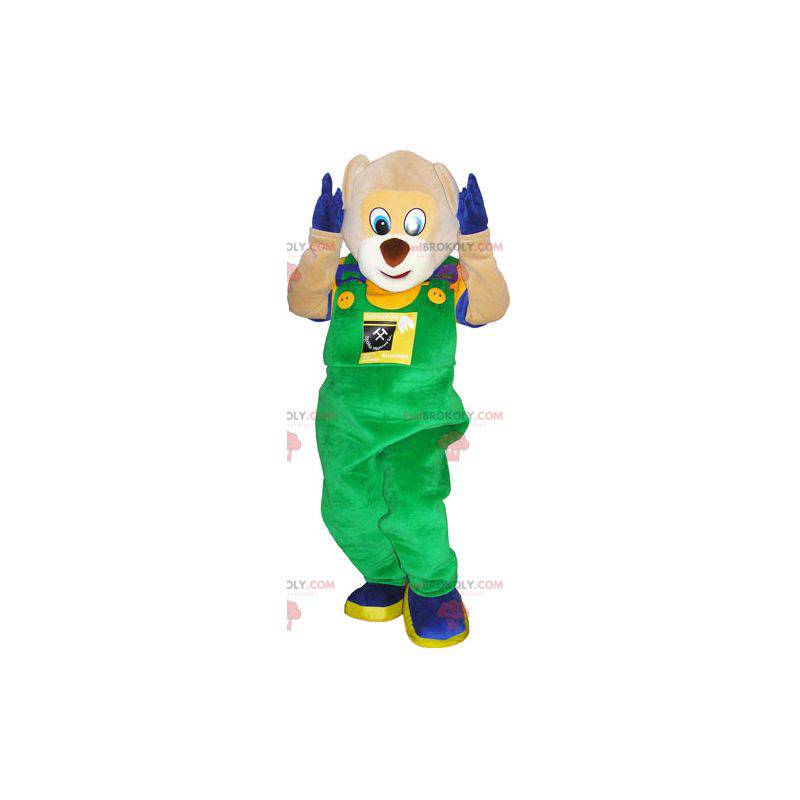 Teddy bear mascot in overalls and colorful outfit -