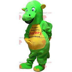 Mascote de dinossauro verde e amarelo chamativo - Redbrokoly.com