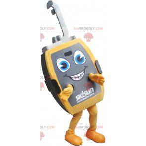 Mascote cinza e amarelo da cabine do teleférico - Redbrokoly.com