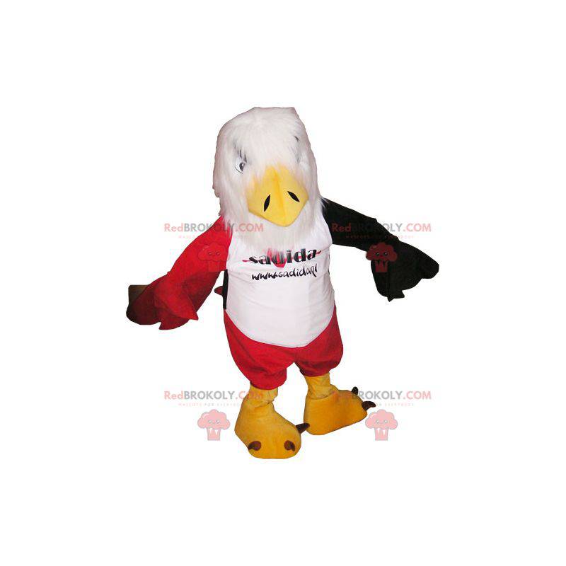 Mascot águila blanca roja y negra con pantalones cortos rojos -