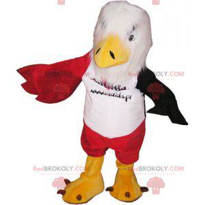 Mascotte d'aigle blanc rouge et noir avec un short rouge -