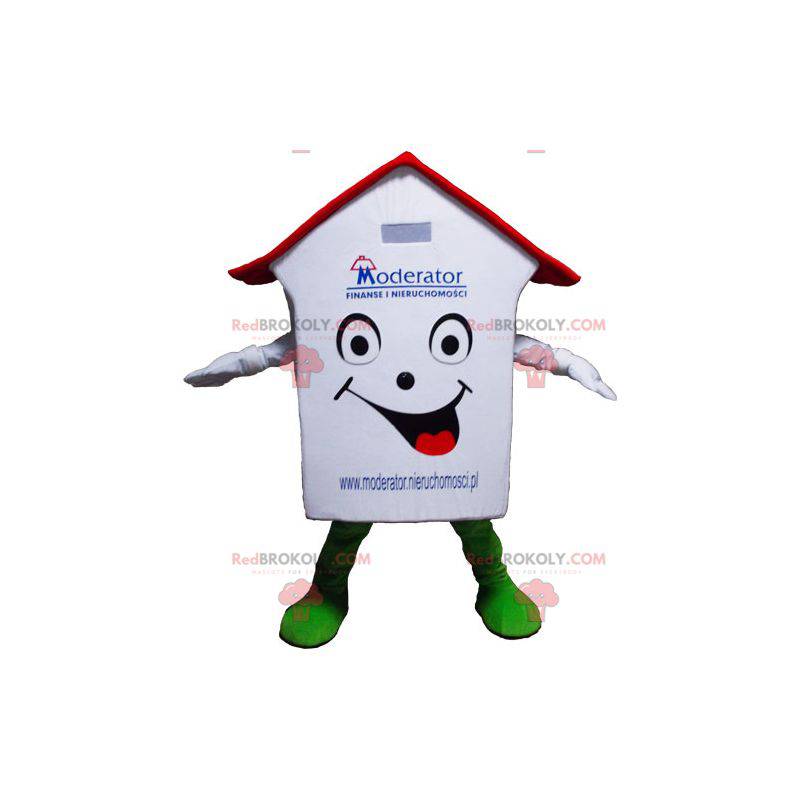 Mascotte de maison blanche rouge et verte très souriante -