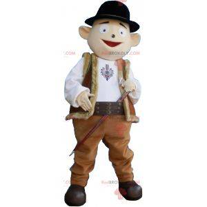 Snowman mascot in shepherd outfit with bowler hat -